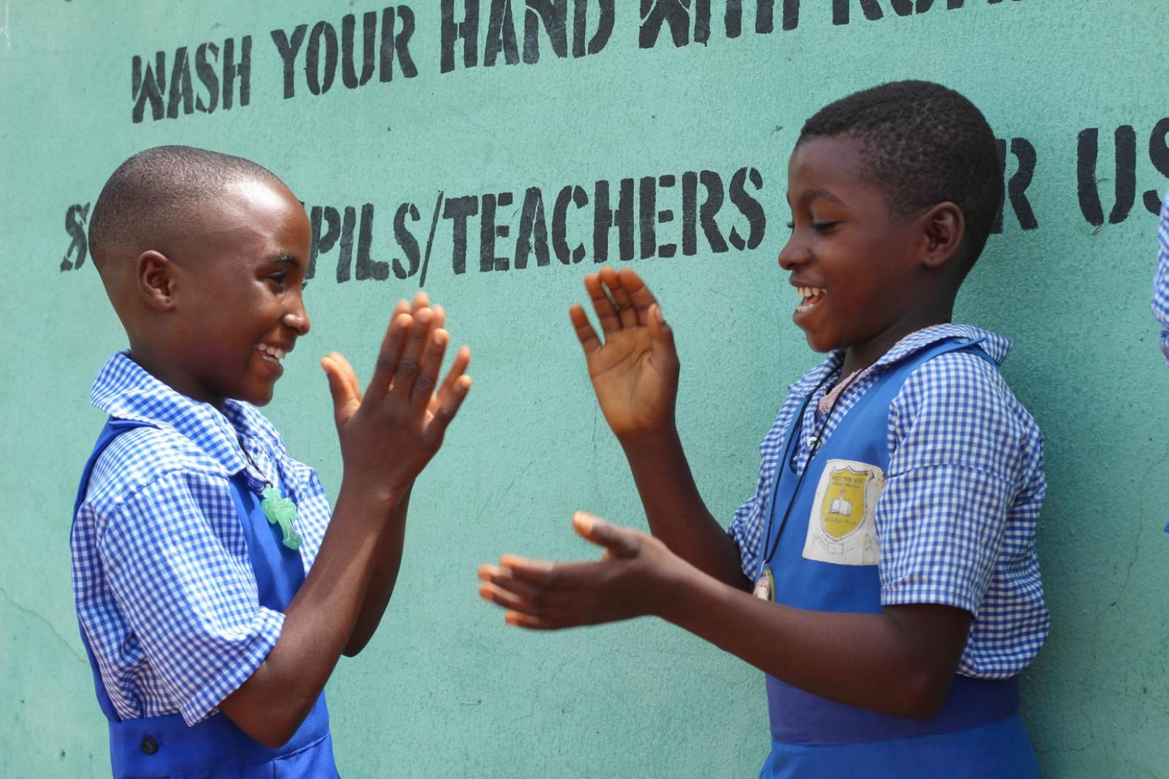 At play: Two members of the Environmental Health Club of NKST primary School Ikpaka in Katsina-Ala, Benue state, North-Central Nigeria
